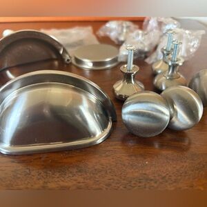 Brushed Nickel Cabinet Knobs, Cup Pulls, & Assorted Hardware.